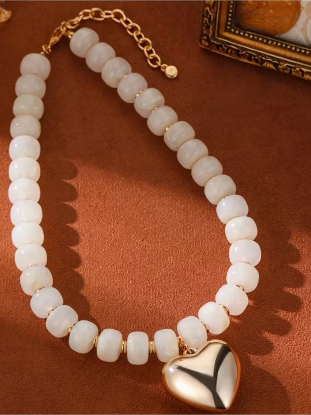 White Beaded Necklace with Gold Heart Pendant